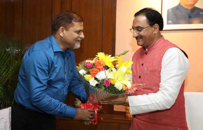 PU VC meets HRD Minister