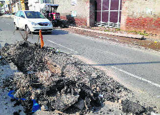 Dug-up portion of service road threat to commuters
