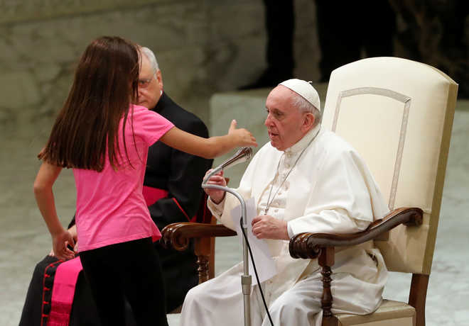 Pope Francis gives sick girl free run of audience stage, delighting crowd