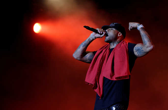 Several hurt as gang storms video set of French rapper Booba