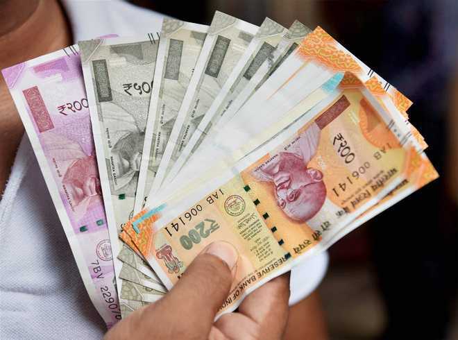 Rupee slips 17 paise to 71.72 vs USD in early trade