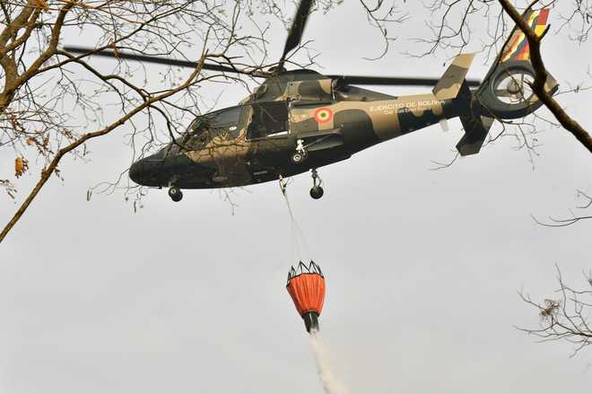 Warplanes dump water on Amazon as Brazil army begins fighting fires