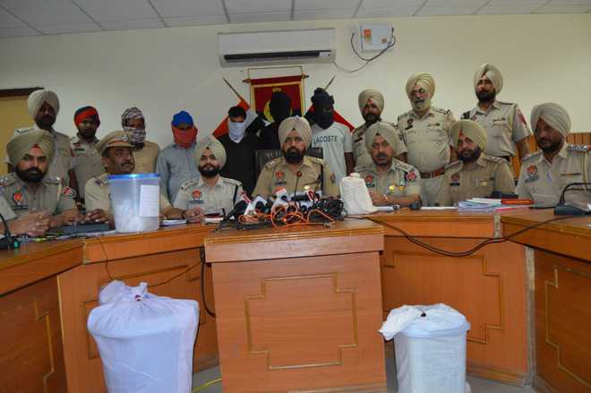 7 held with heroin, arms