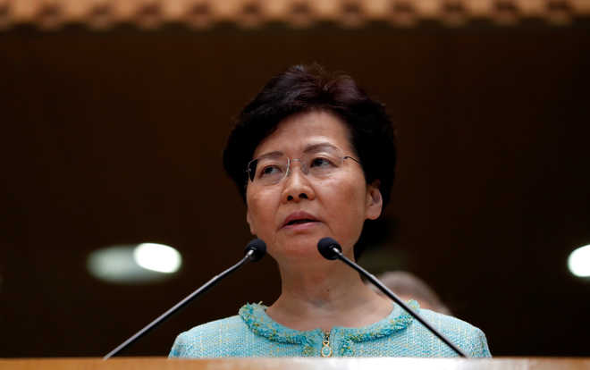 Hong Kong leader says China backs her ‘all the way’