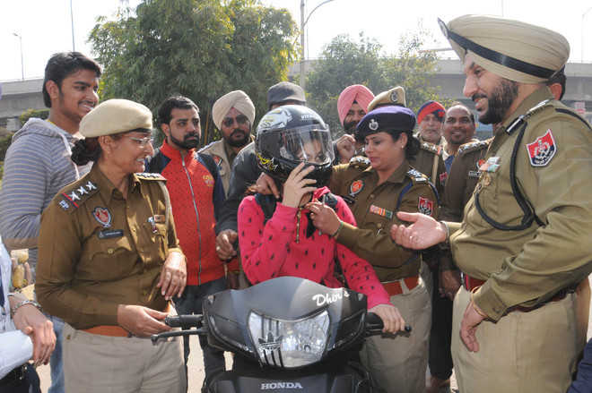 To avoid hefty challans, motorists opt for helmets