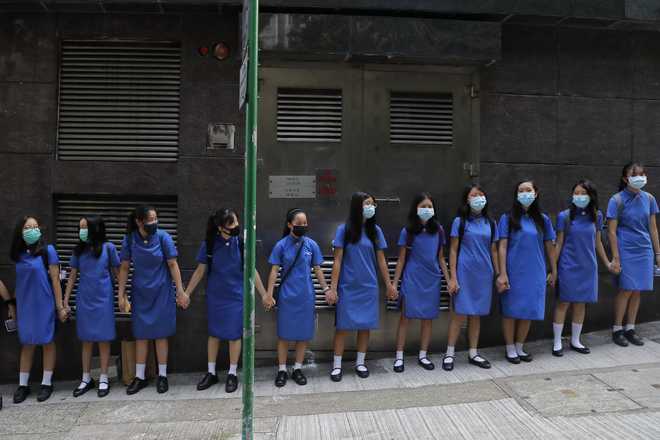 HK school students form human chain after weekend of protests