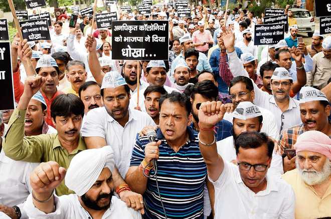 AAP protests against delay in regularisation of colonies